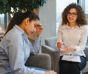 Patient discussing mental health with a professional therapist