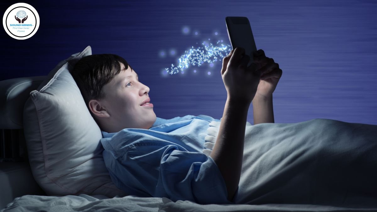 A young child staring at a tablet screen in a dark room, illustrating the impact of excessive screen time on child mental health.